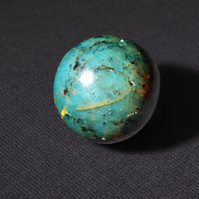 Natural cognac blue Dominican amber sphere/ball 19mm
